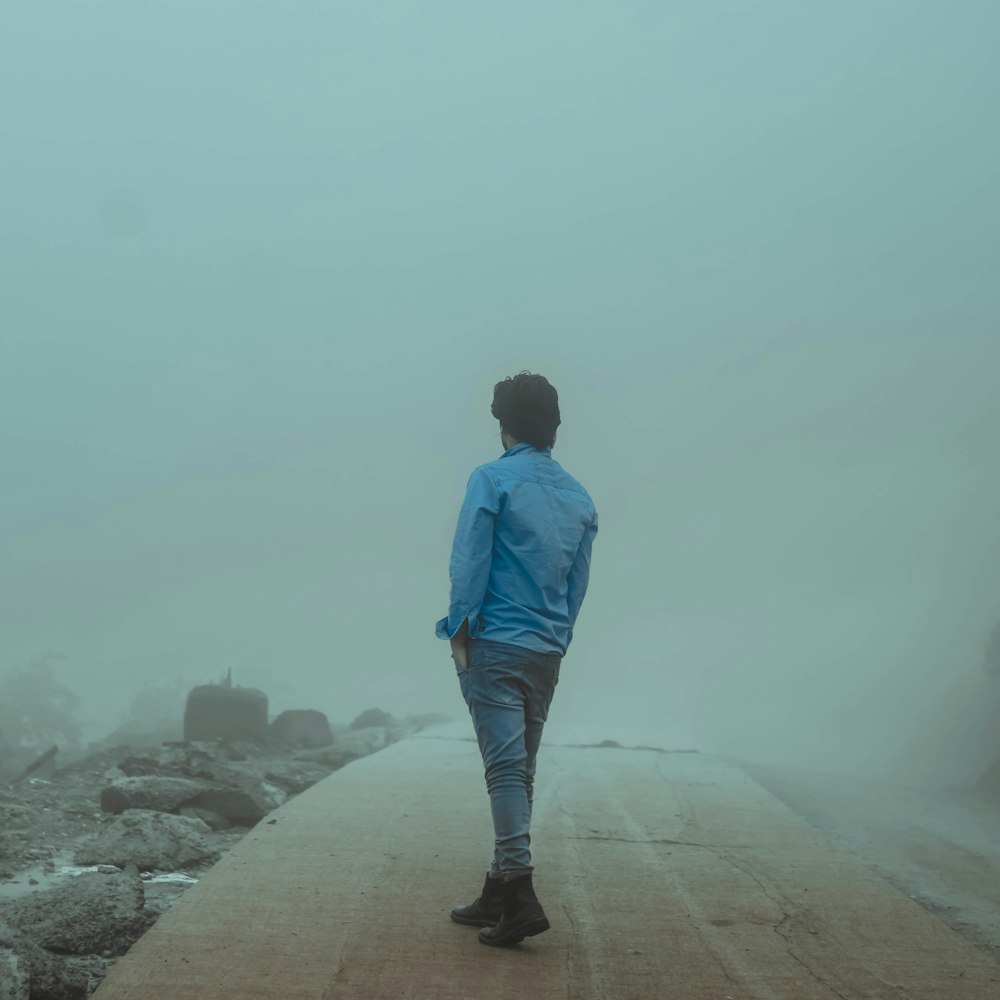 a man standing on a road