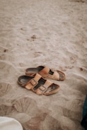 Breathable summer shoes on a sandy beach.