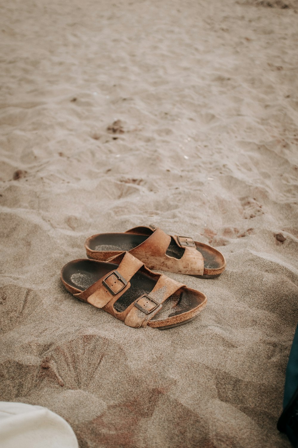 a pair of sandals on a carpet