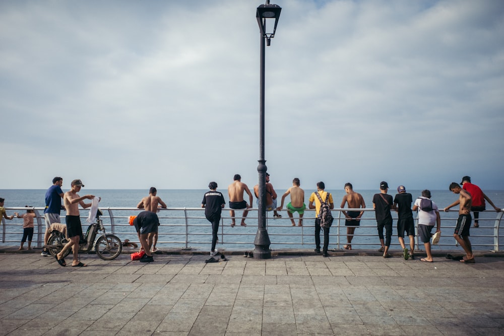 a group of people on a boardwalk