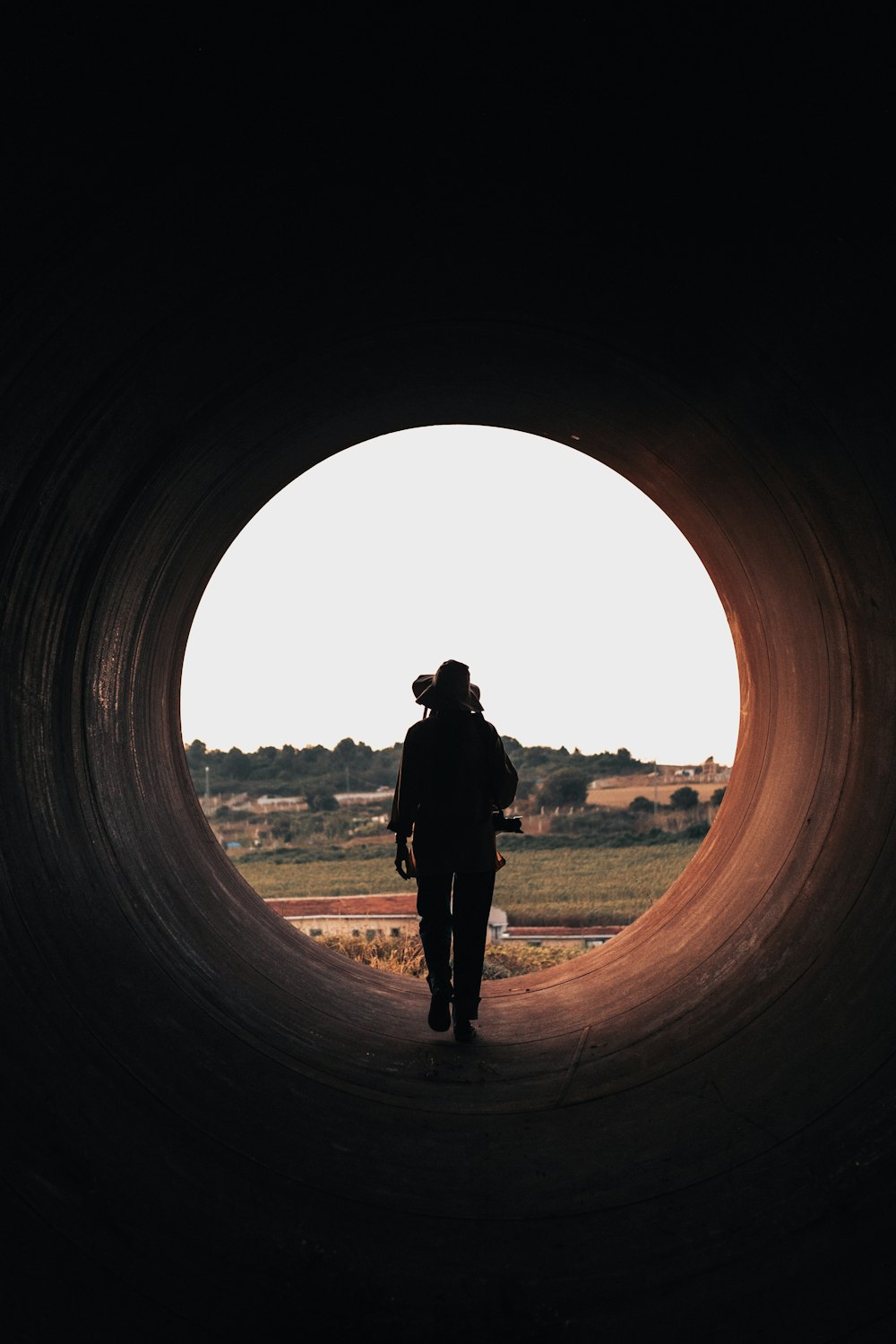 a man standing in a tunnel