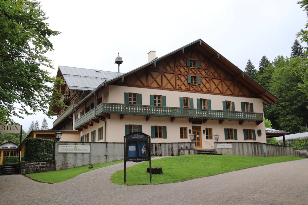 a large house with a green lawn