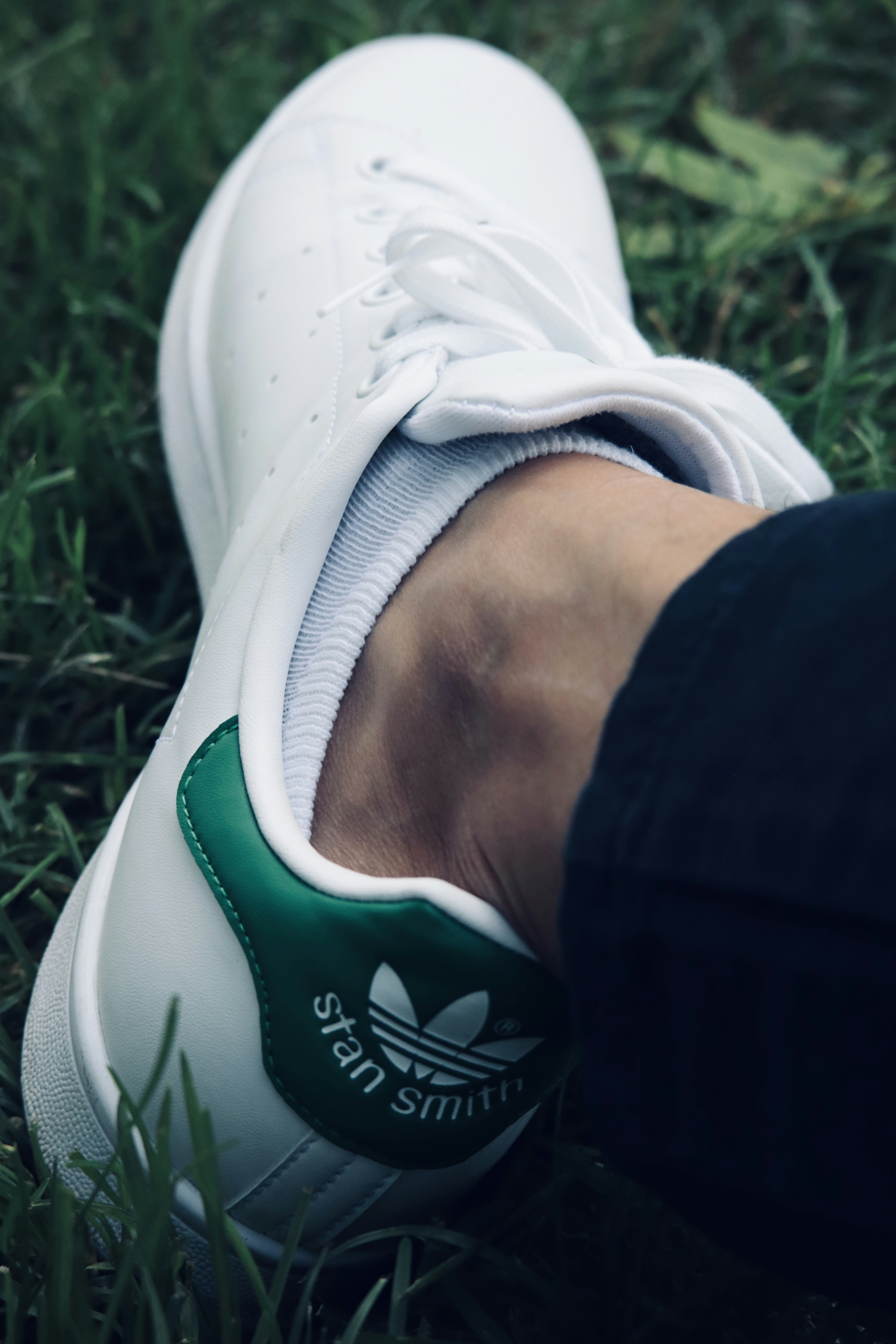 A person's foot in a shoe photo Free Kelowna Image on Unsplash