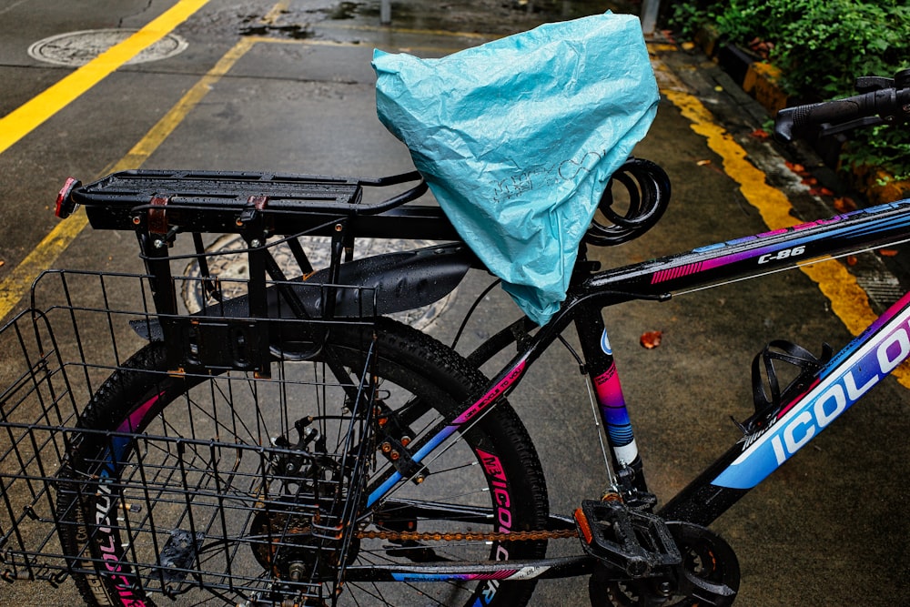 a bicycle with a blue bag on the back