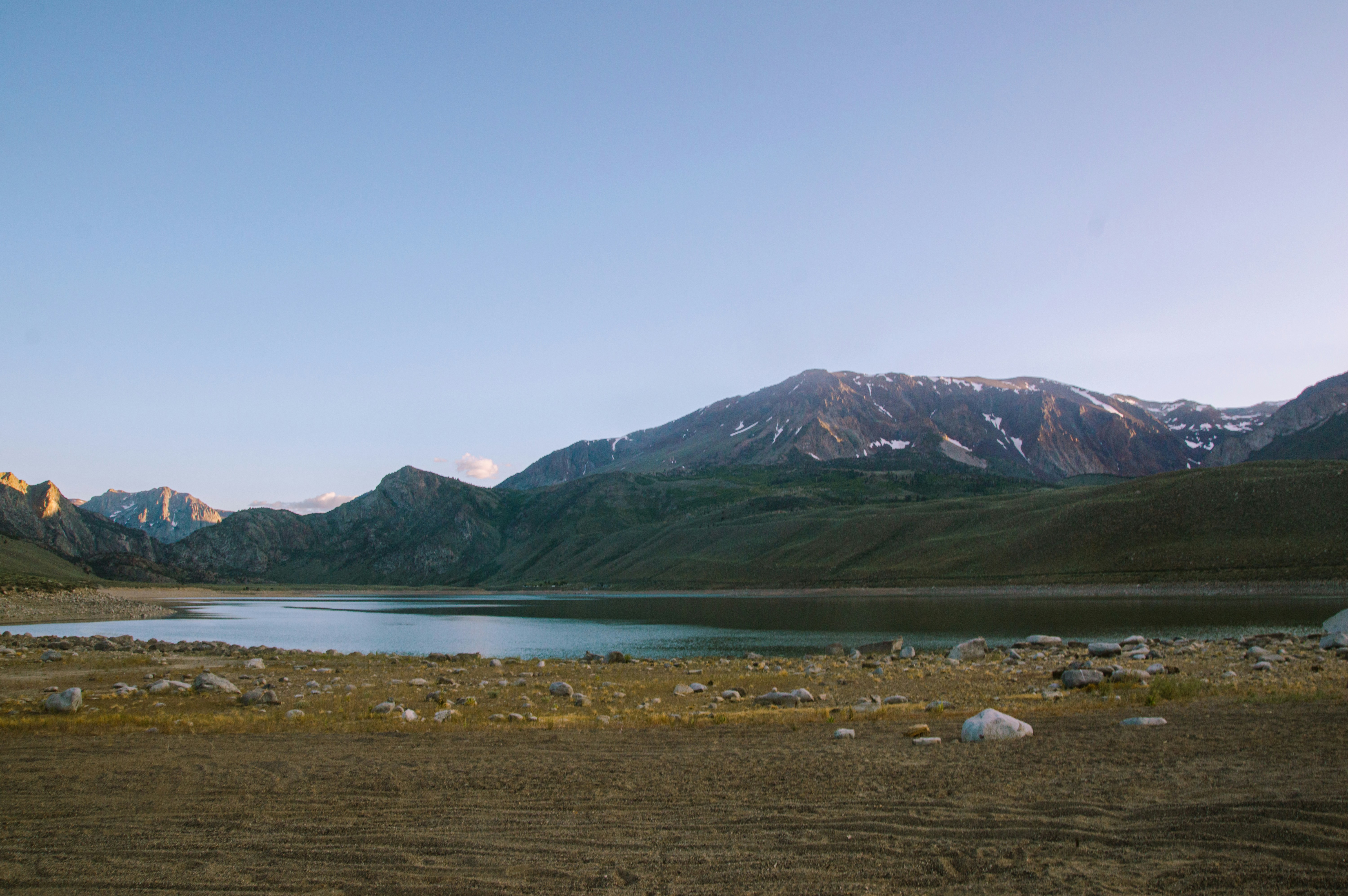 a lake with mountains in the background
