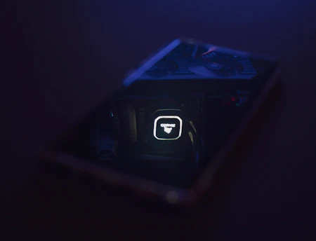 Close-up of a sleek Epicooler device glowing softly on a wooden table.