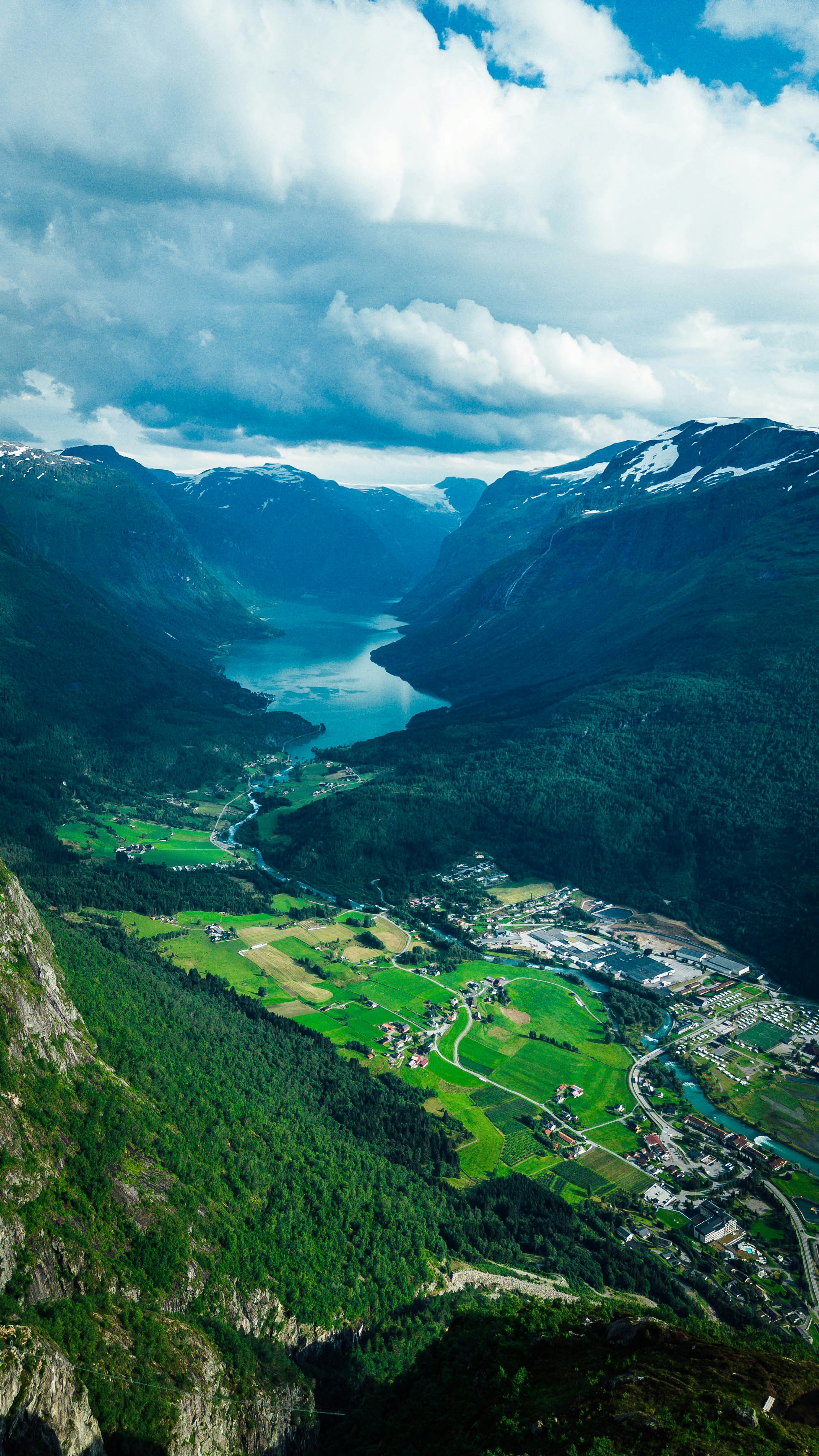 Panoramic view of Uttarakhand mountains with snow-capped peaks and lush valleys showcasing tour destinations