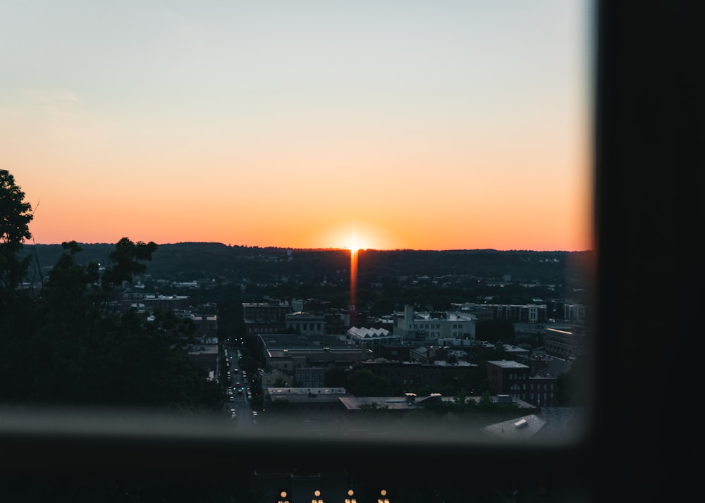 a sunset over a city