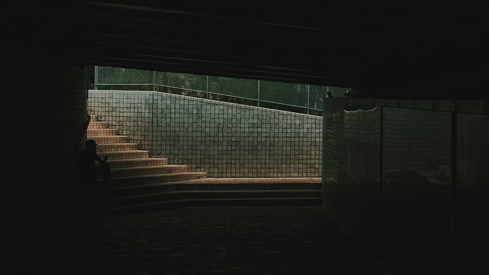 a dark room with a staircase