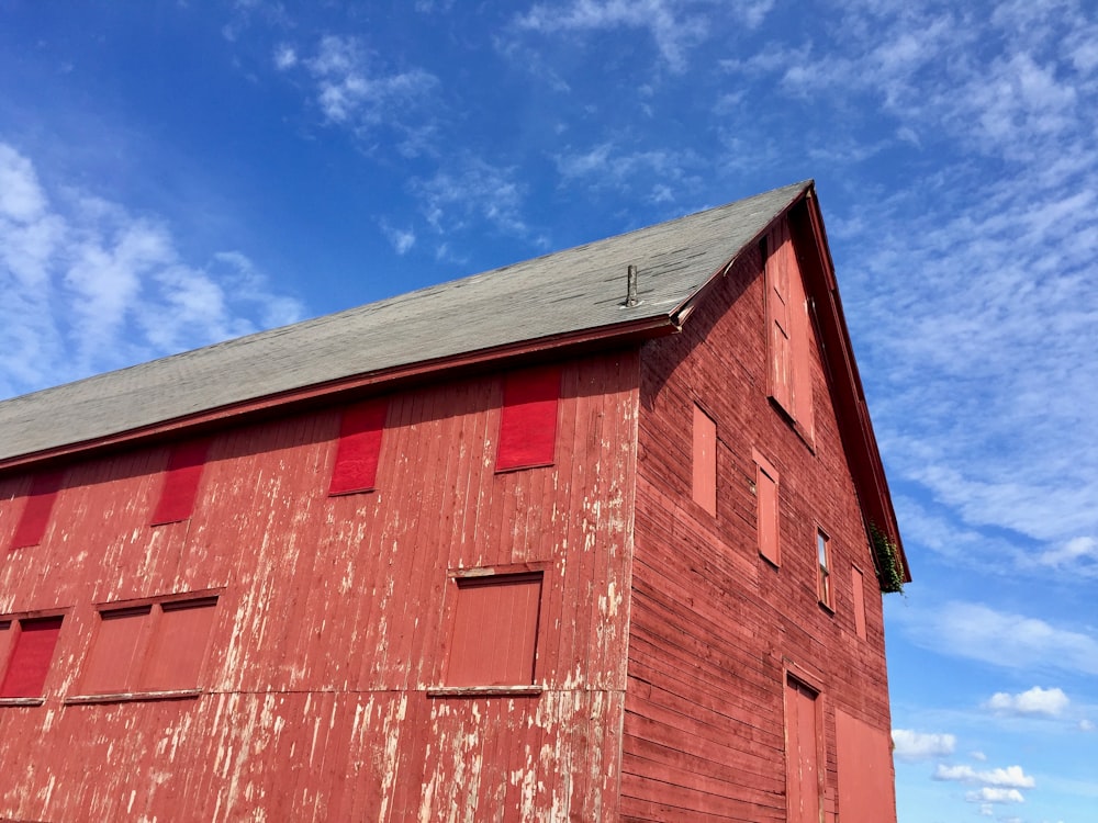 a red barn under a blue sky