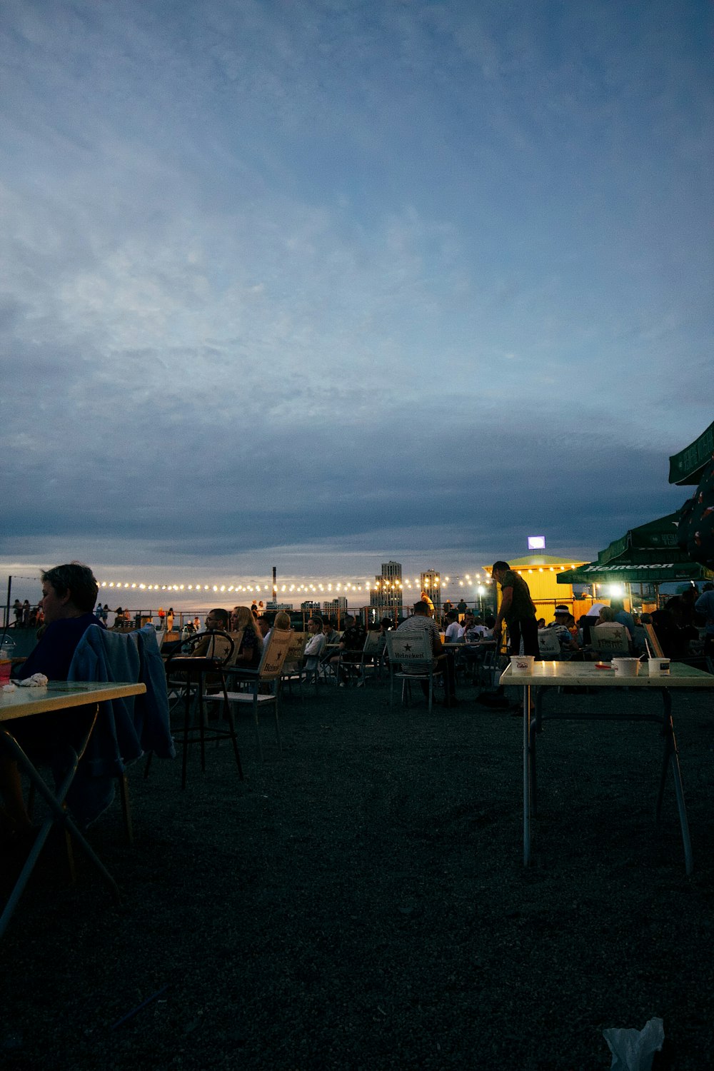 people sitting at tables outside