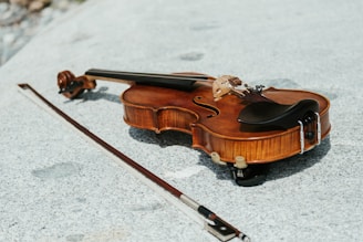 a violin on a white surface