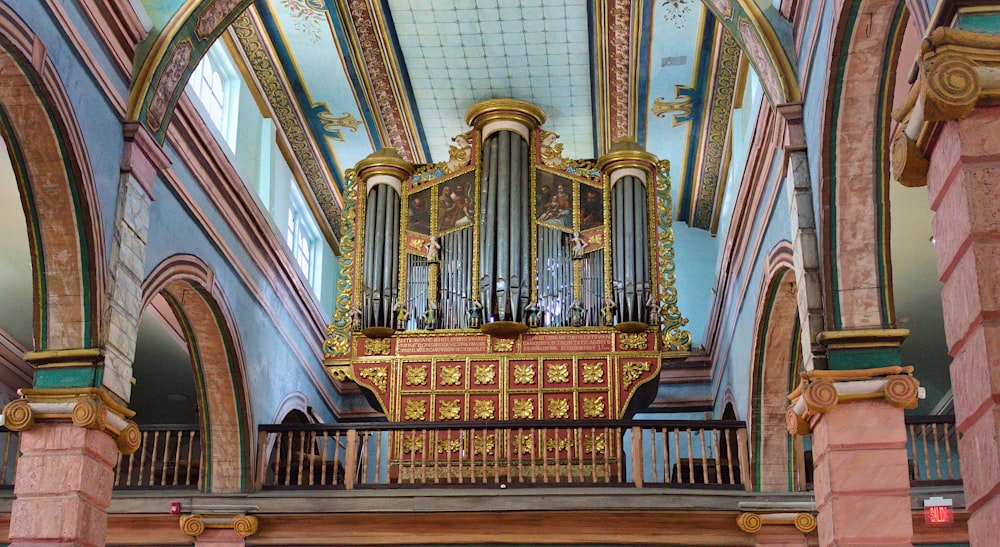 a large ornate organ in a building