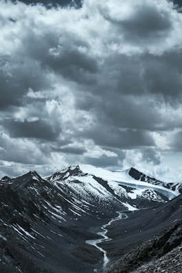 a mountain with clouds above it