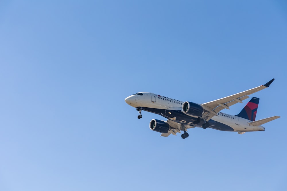 a large airplane flies through the air