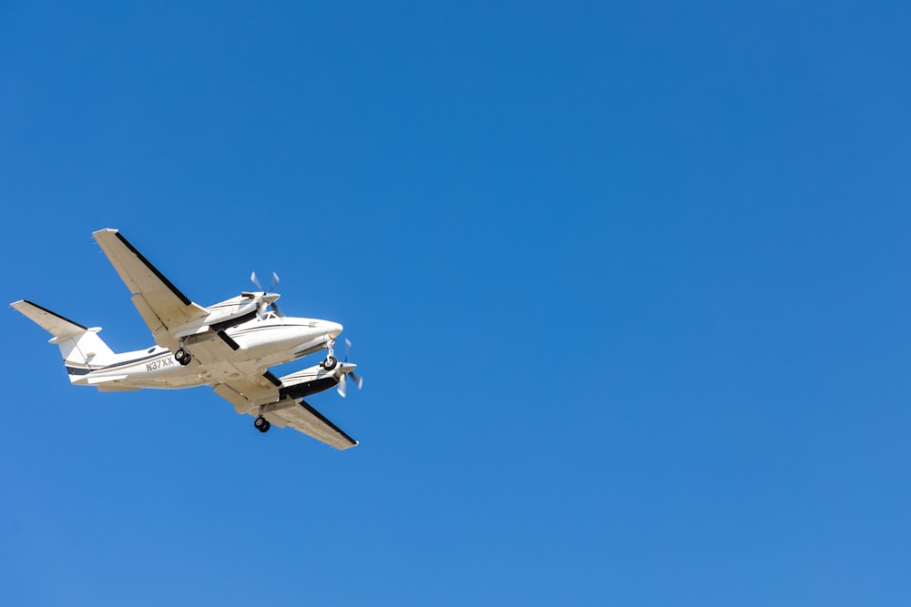 a small airplane flying in the sky