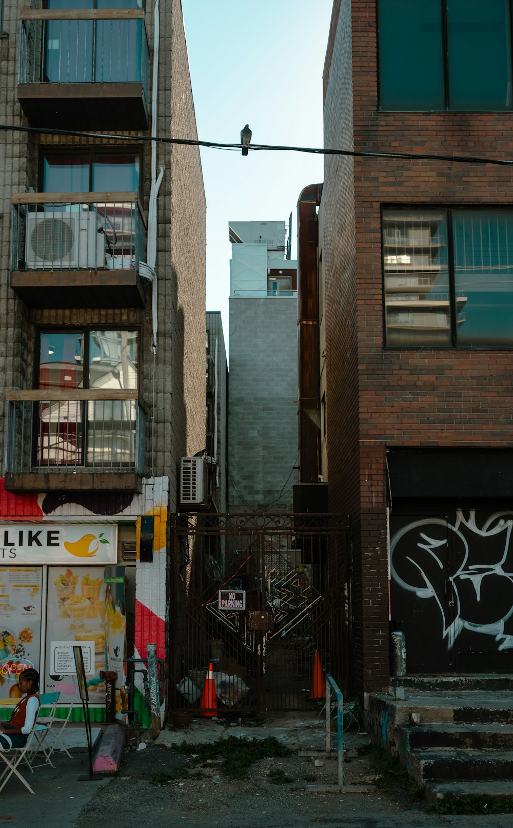 a person sitting on a chair outside a building