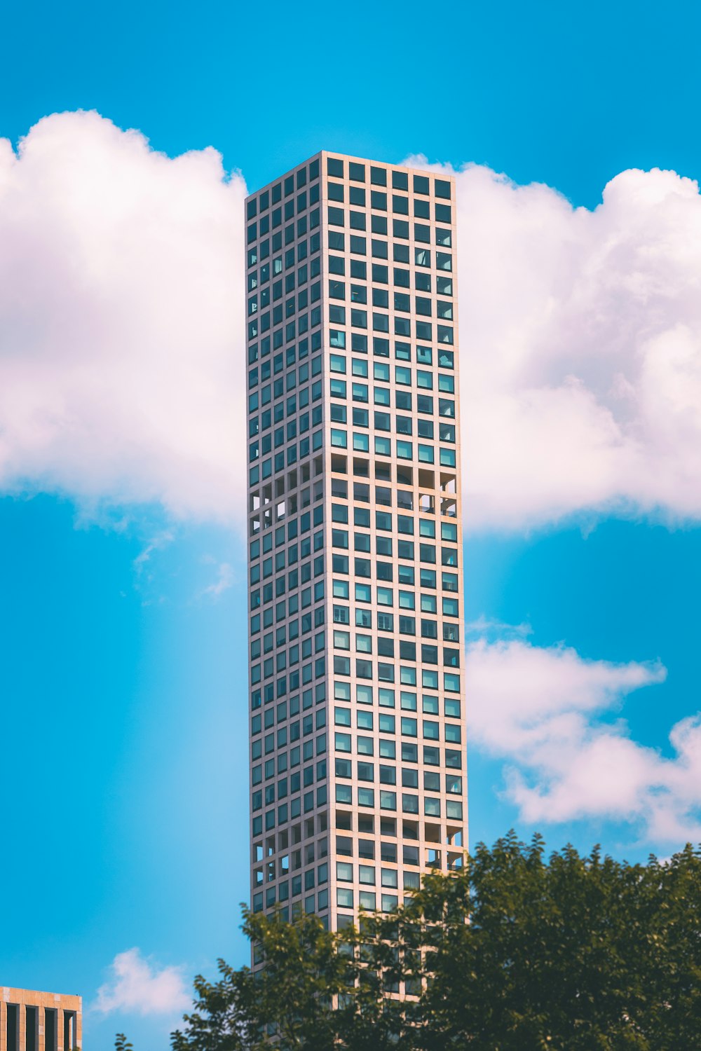 a tall building with a blue sky