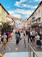 A bustling street market alive with colorful stalls and happy faces.