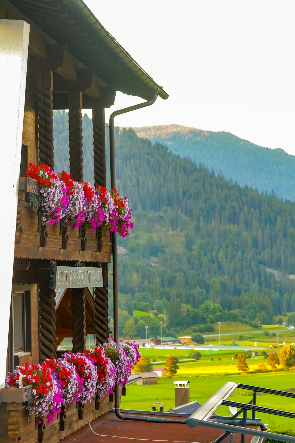 a building with a view of a valley and mountains