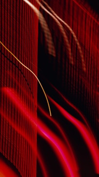 Abstract soundwave art in vibrant reds and blacks representing intense musical energy.