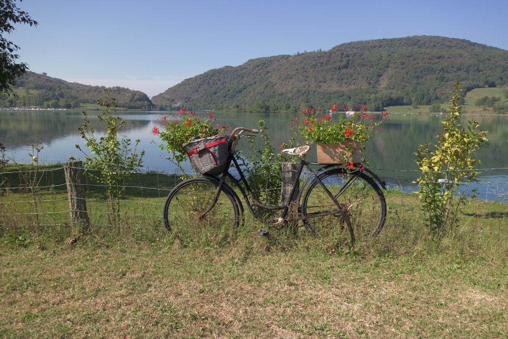 a bicycle parked on a fence