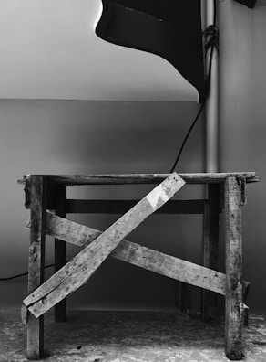 Vintage image showing the original product prototype displayed on a workbench.