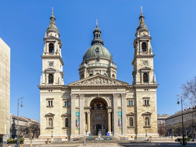 a large building with towers with St. Stephen's Basilica in the background
