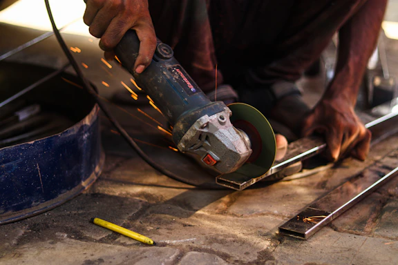 a man working on a piece of wood