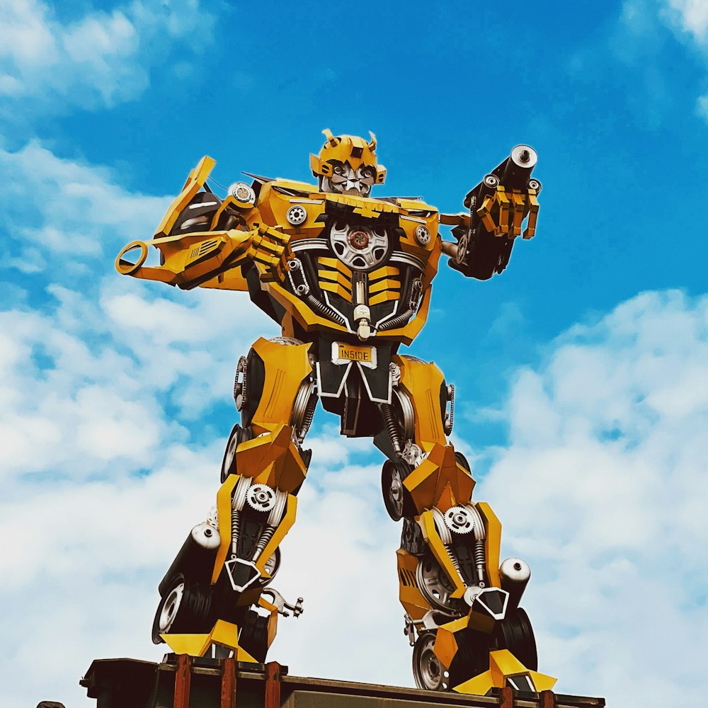 a large yellow and black robot