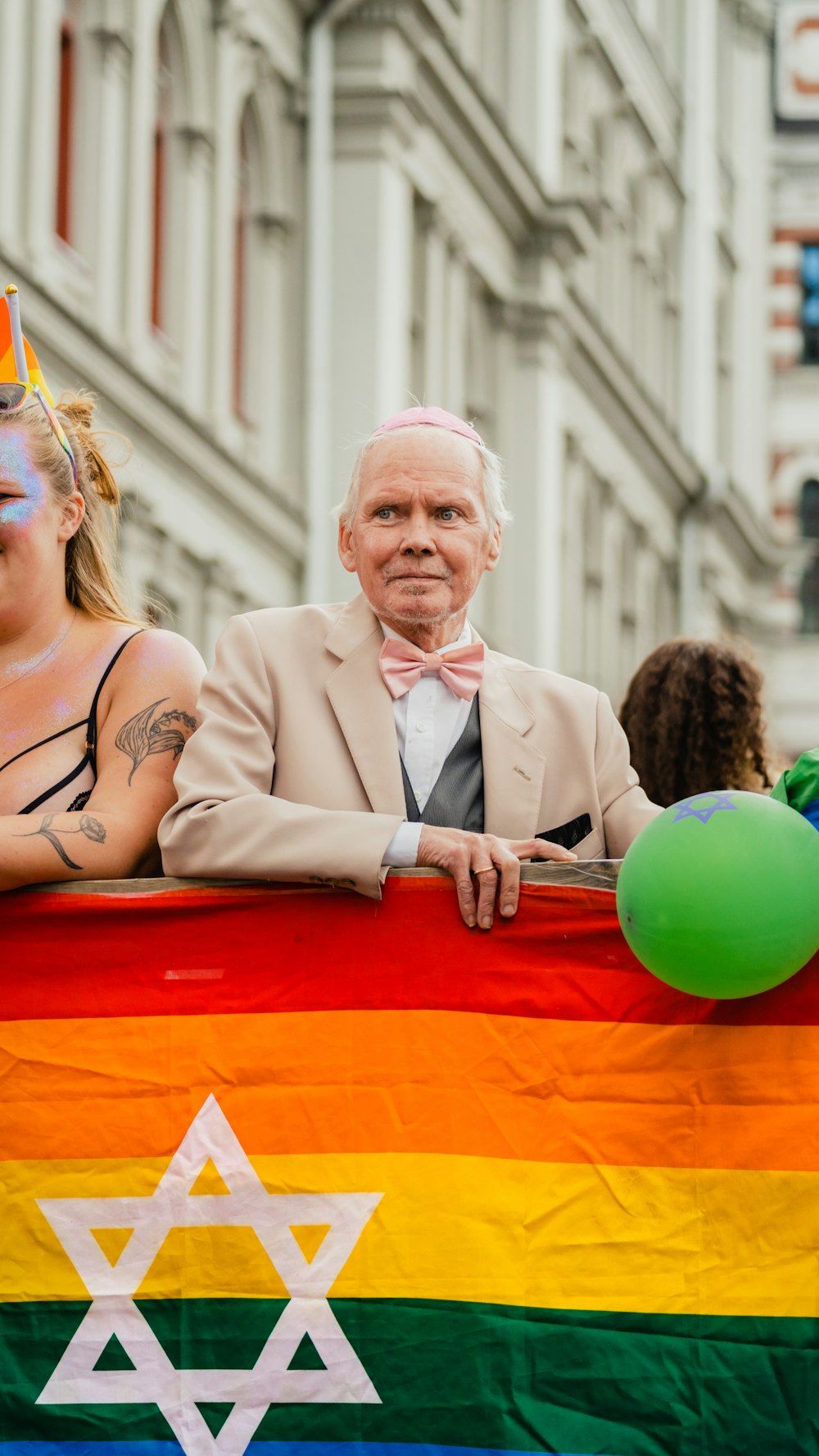 a person in a suit holding a flag