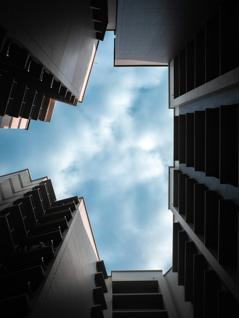 looking up at tall buildings