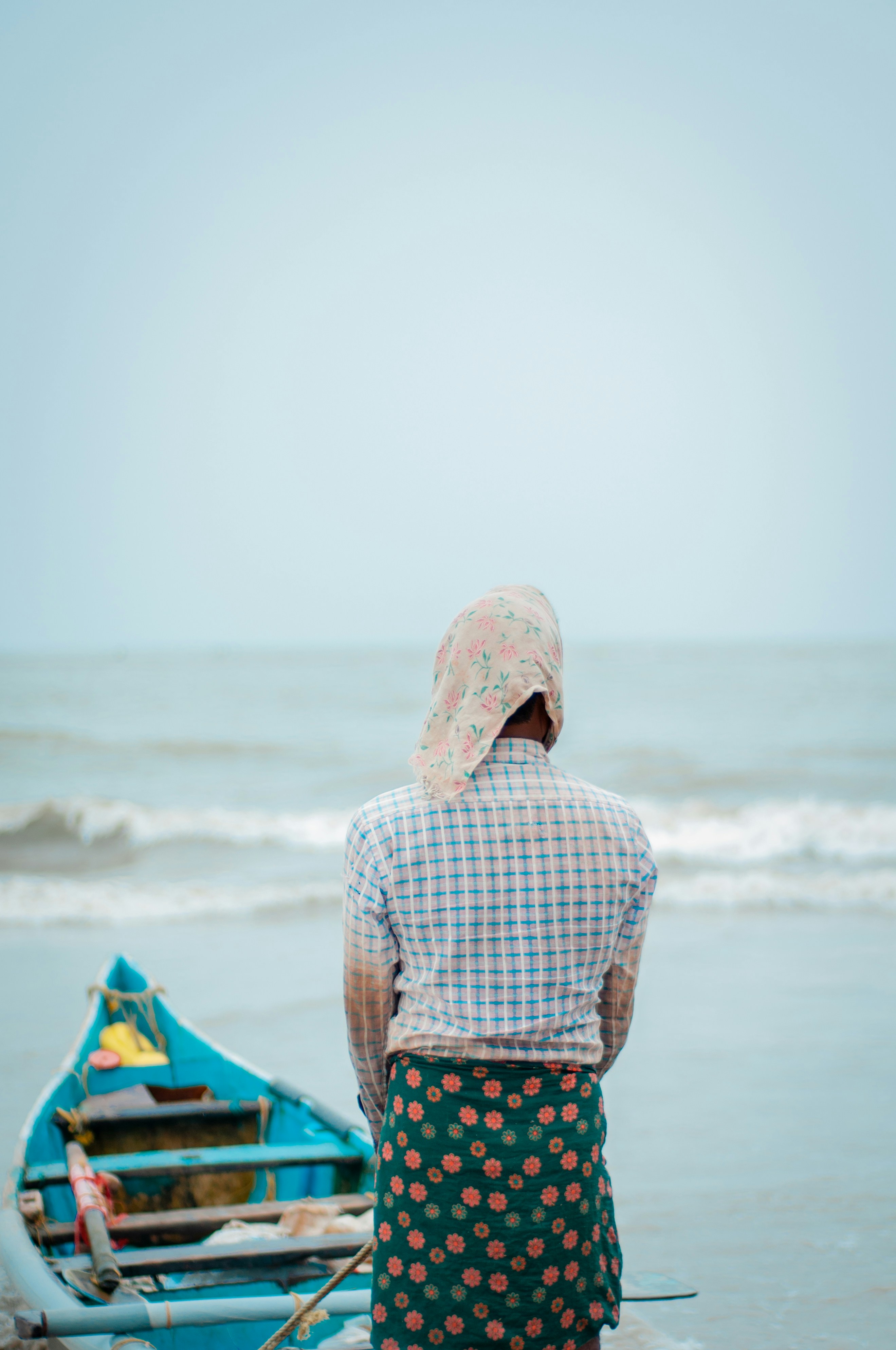 a person stands on a boat