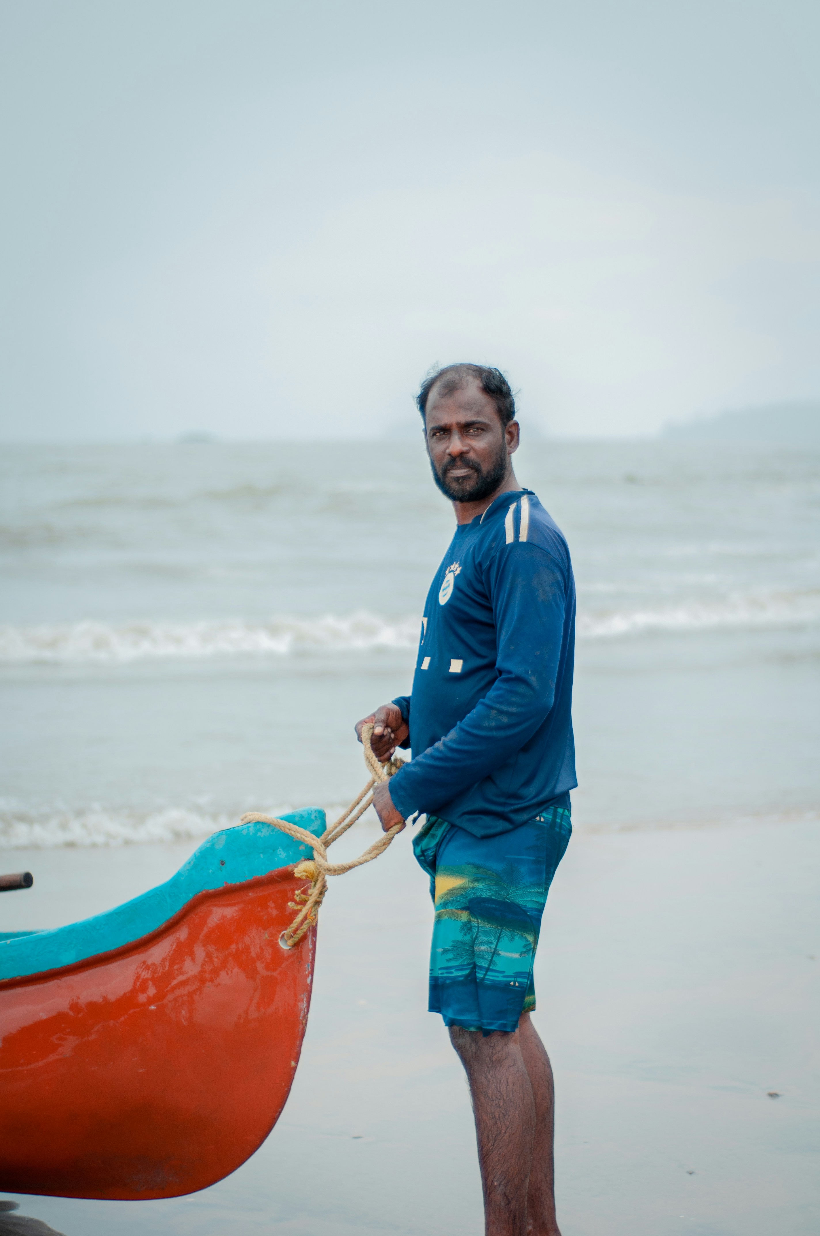 a man holding a surfboard