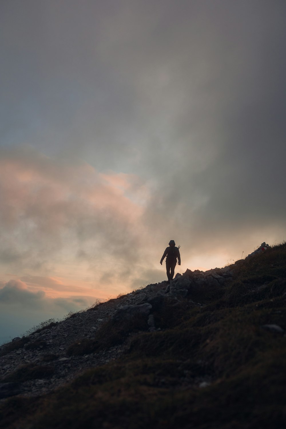 a person standing on a hill