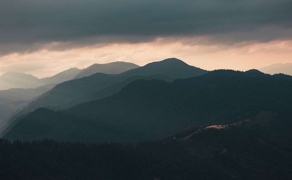 a mountain range with clouds