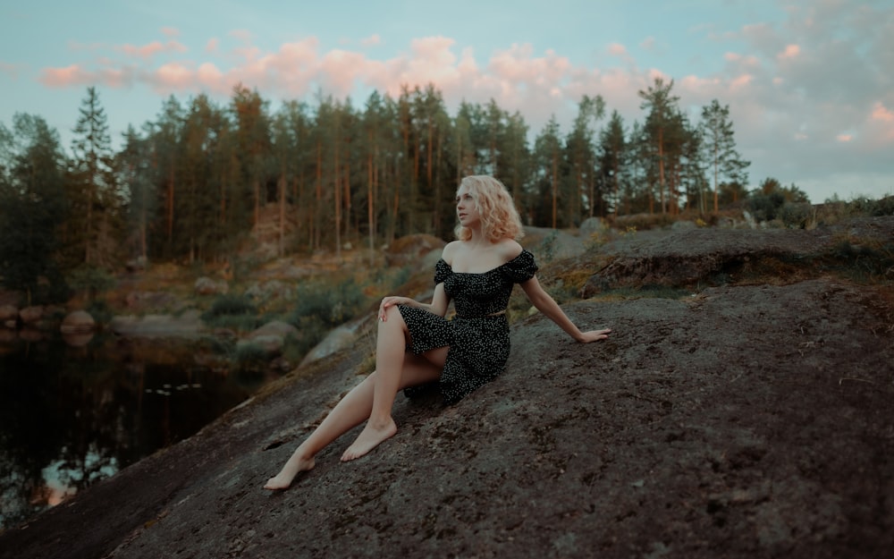 a person sitting on a dirt path