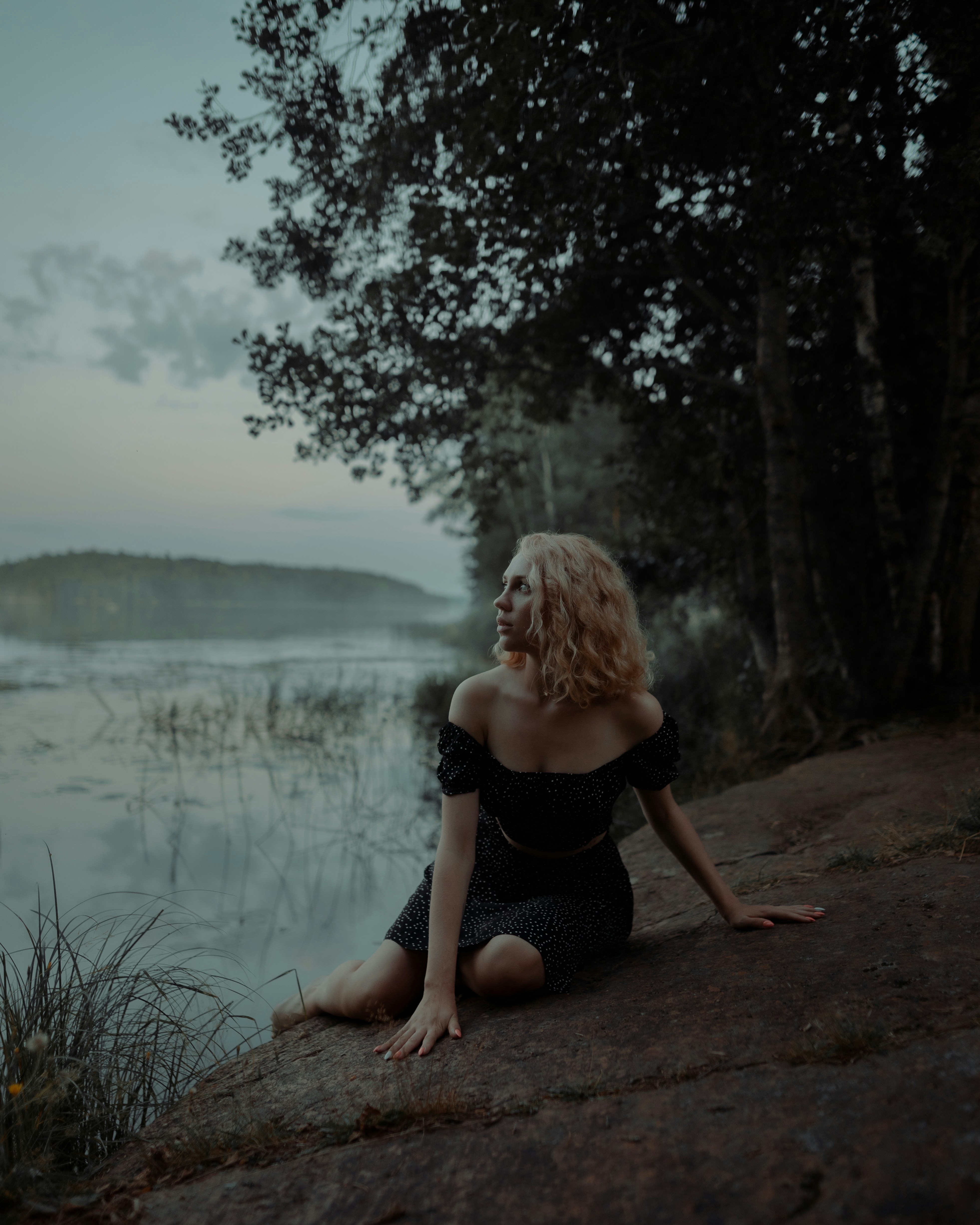 a person standing in front of a lake