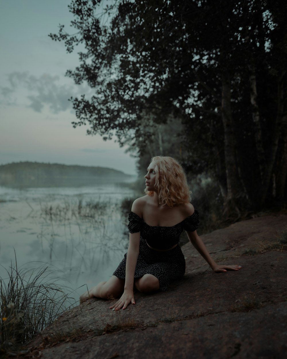 a person standing in front of a lake