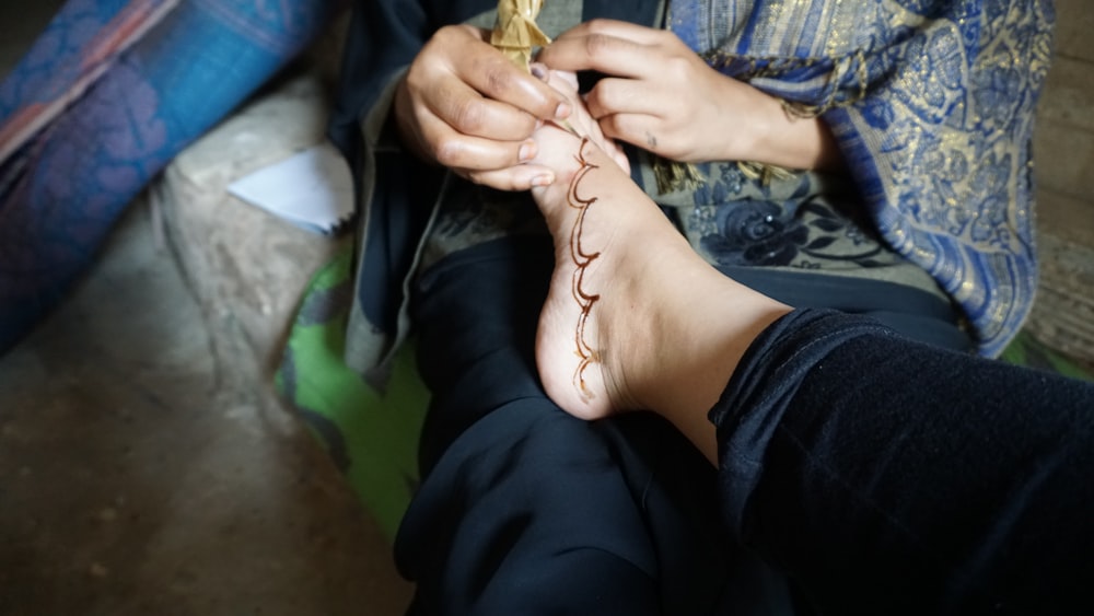 a person holding a snake