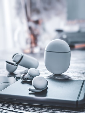 Wireless earbuds showcased in a modern setting.