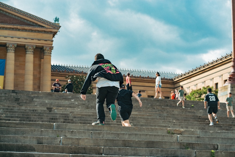 a group of people play on some steps