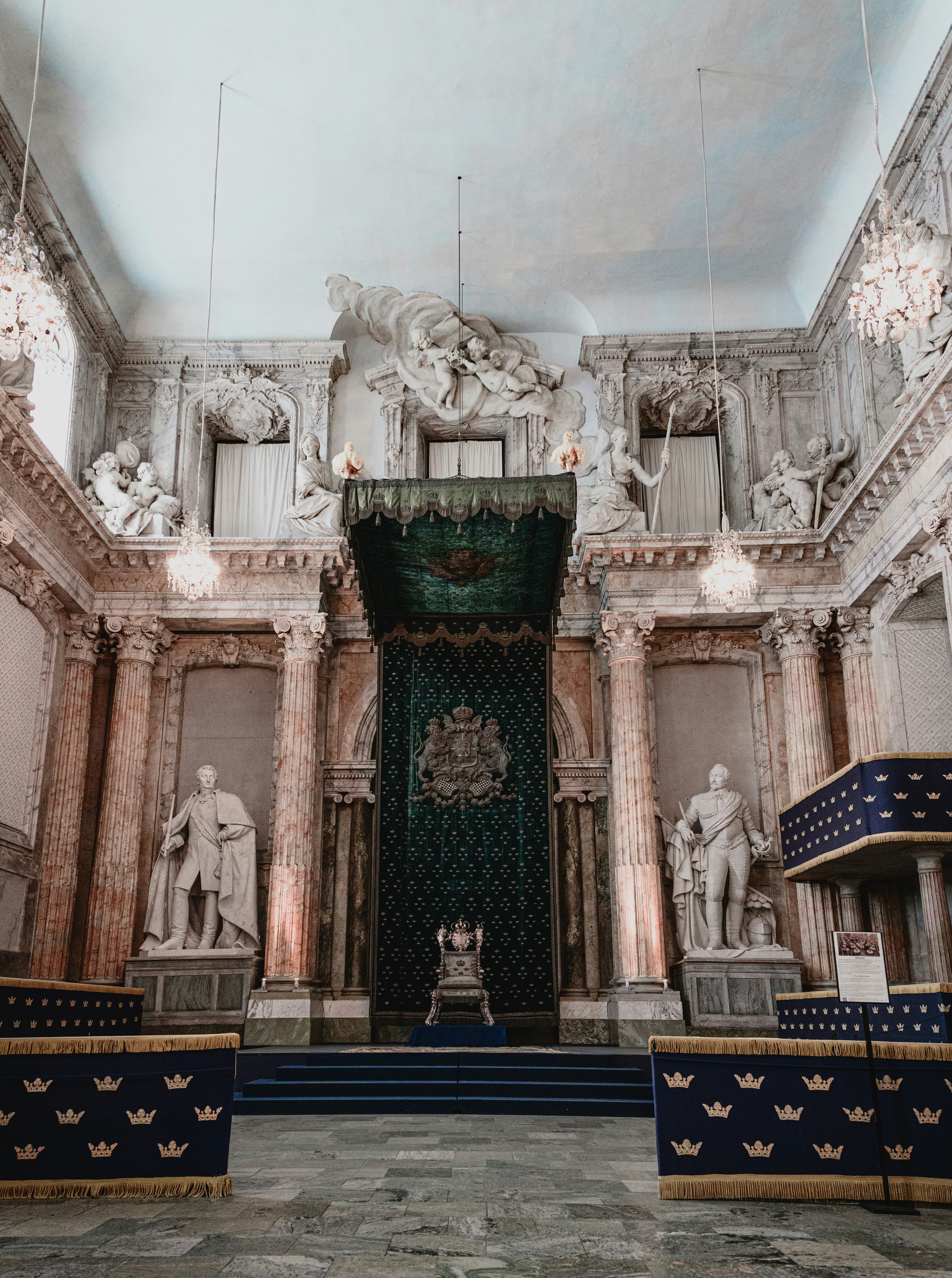 a building with statues and a door