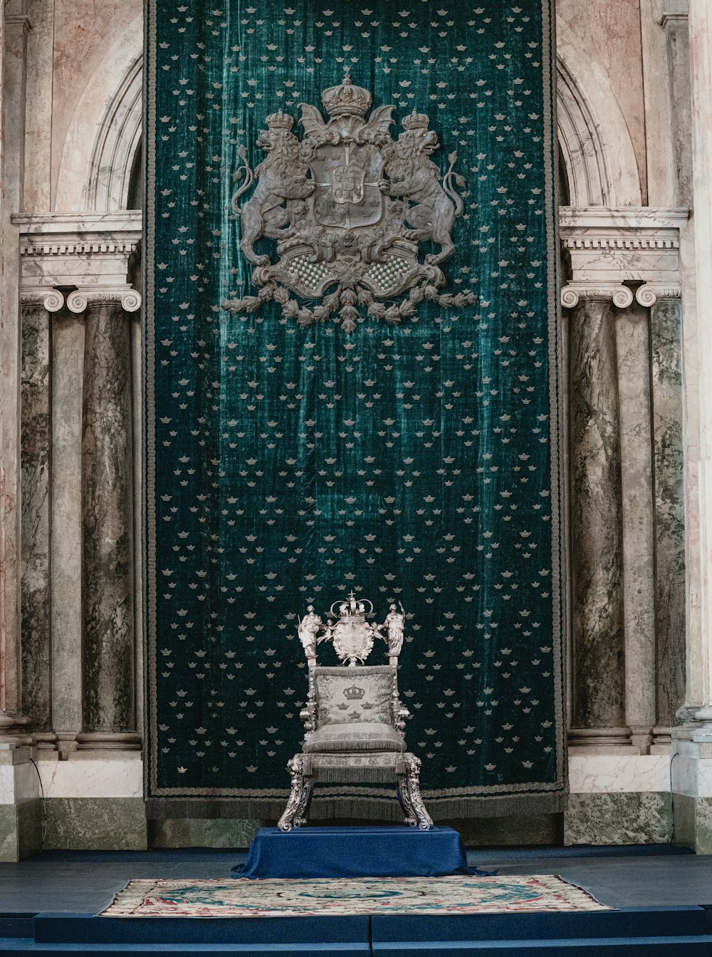 a statue in front of a green door