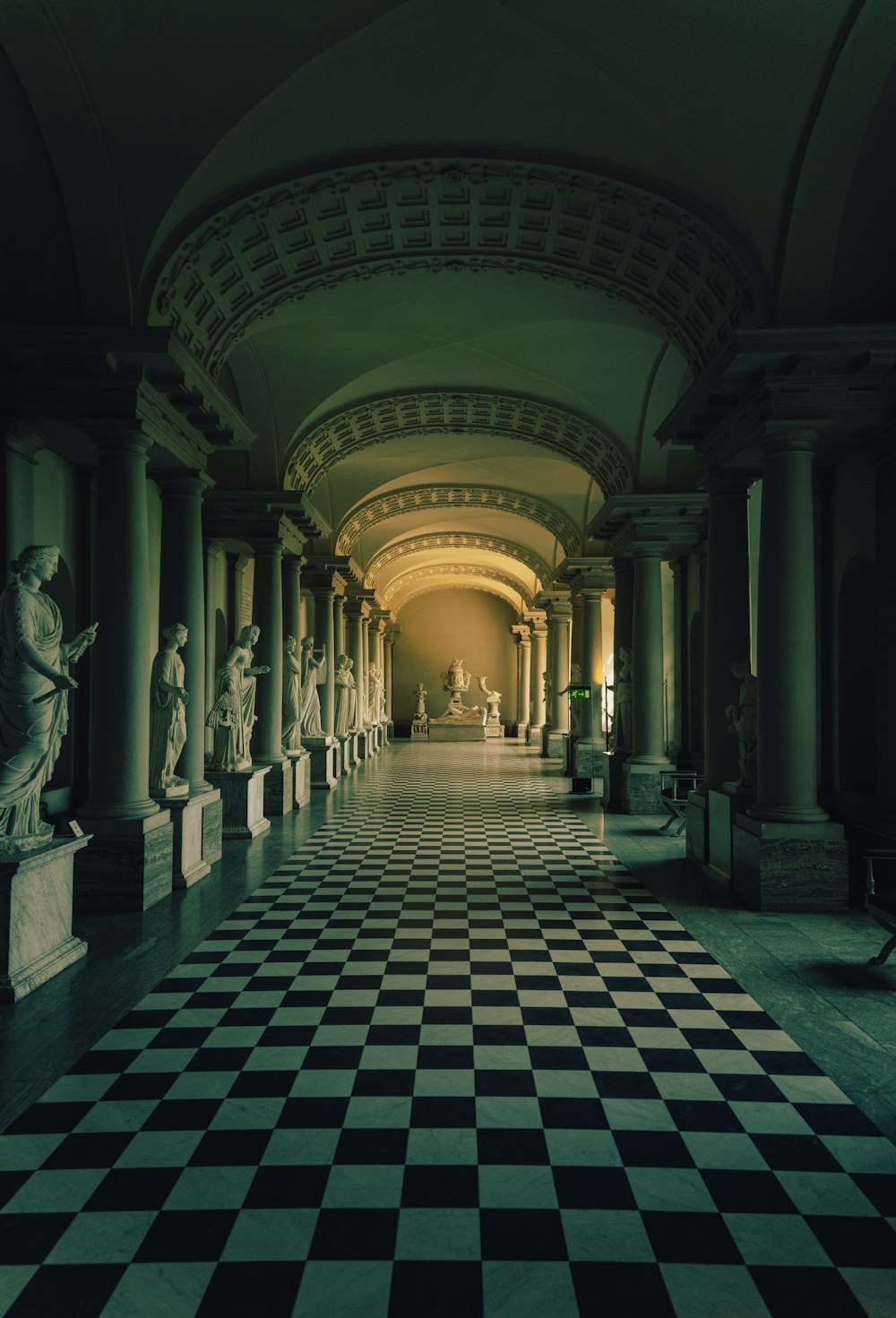 a large room with statues