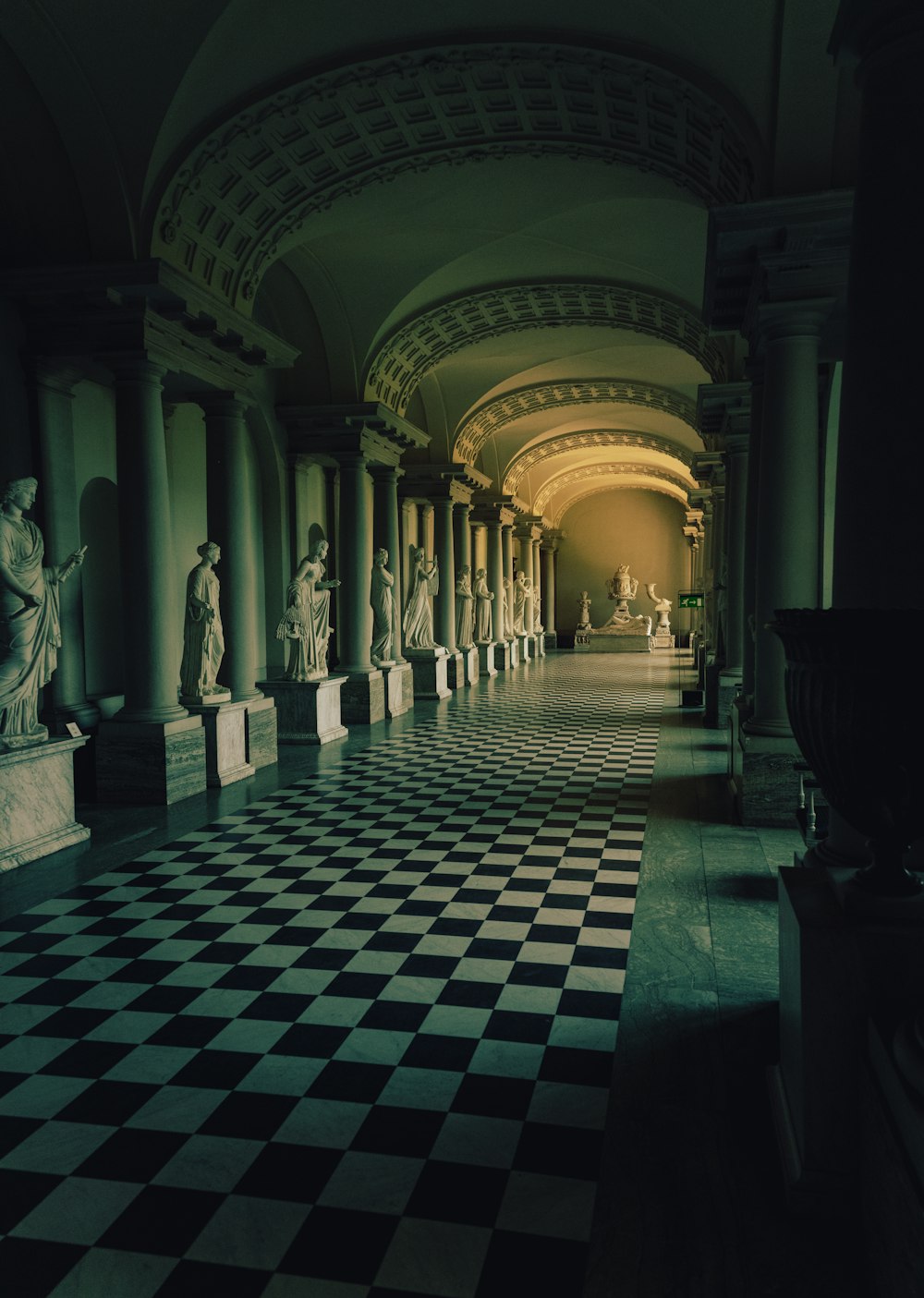 a large stone hallway with statues