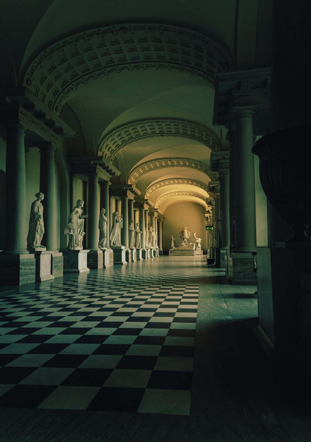 a large stone hallway with statues