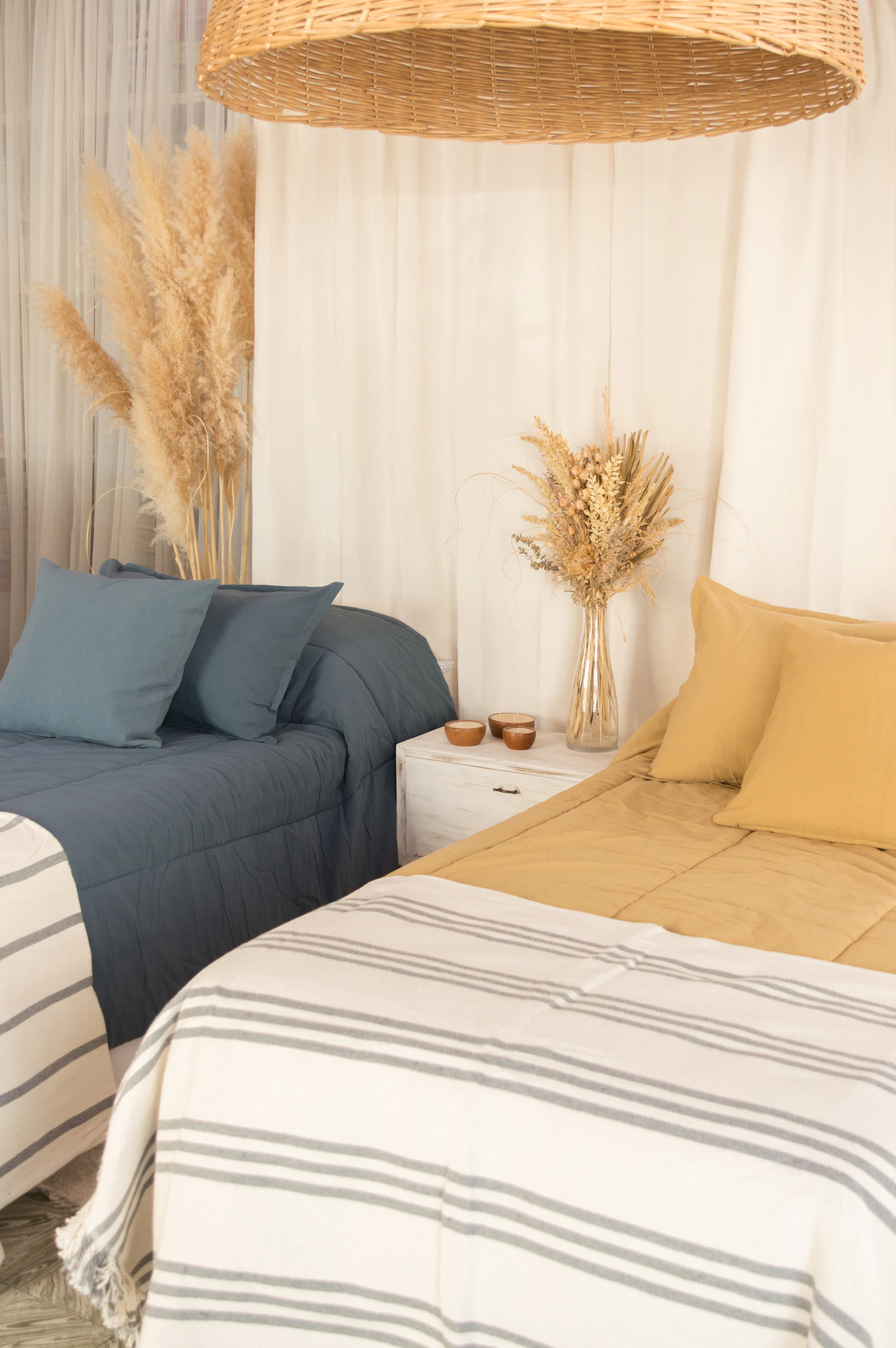 a bed with a lamp and pillows