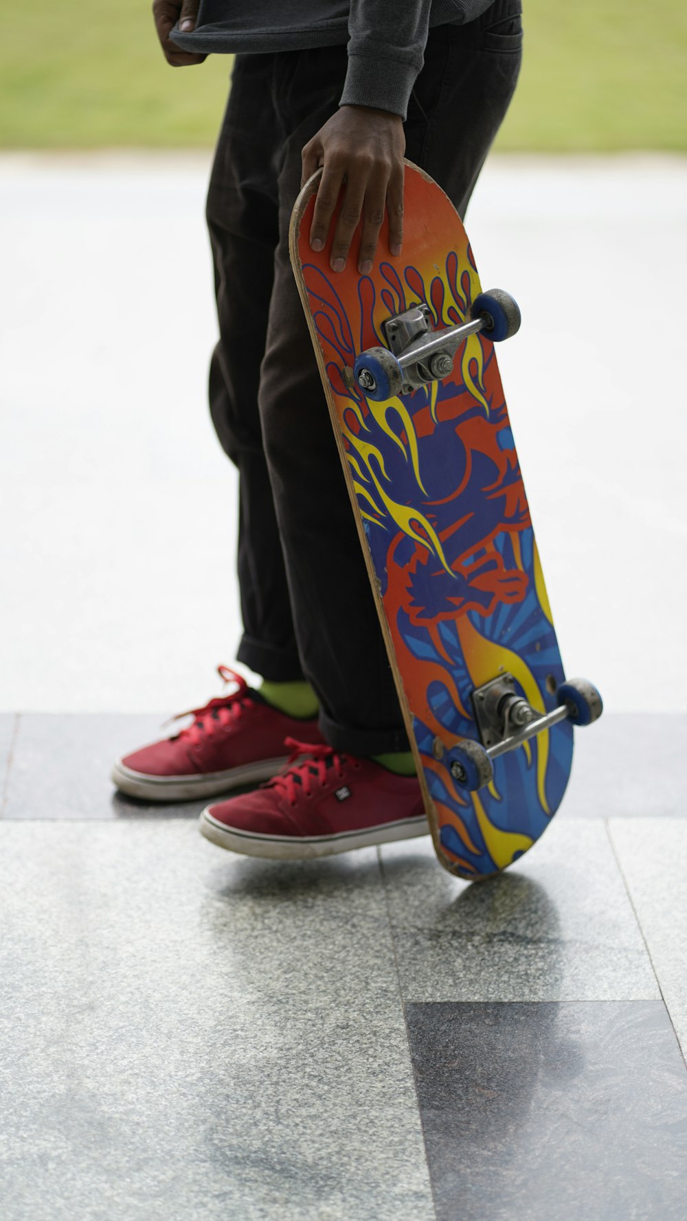 a person holding a skateboard