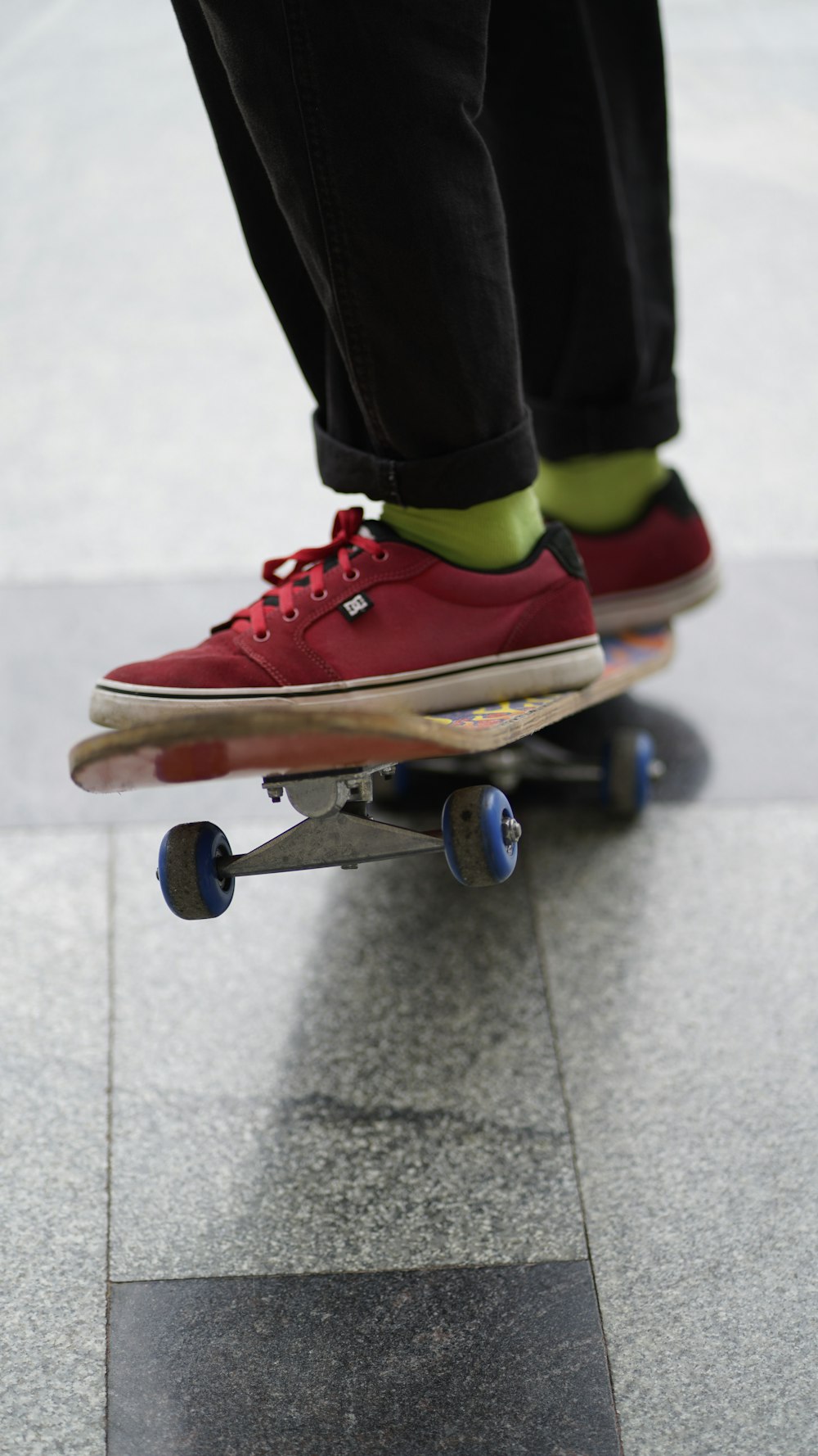 a person stands on a skateboard